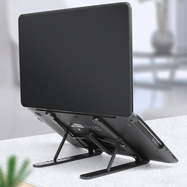 Foldable and height-adjustable laptop stand