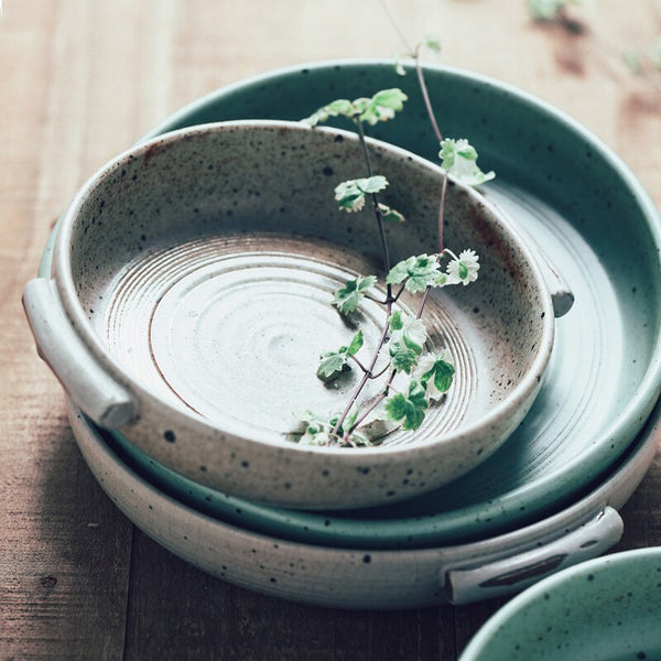 Handmade ceramic plate with handle