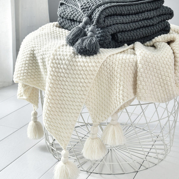 Knitted blanket with tassels